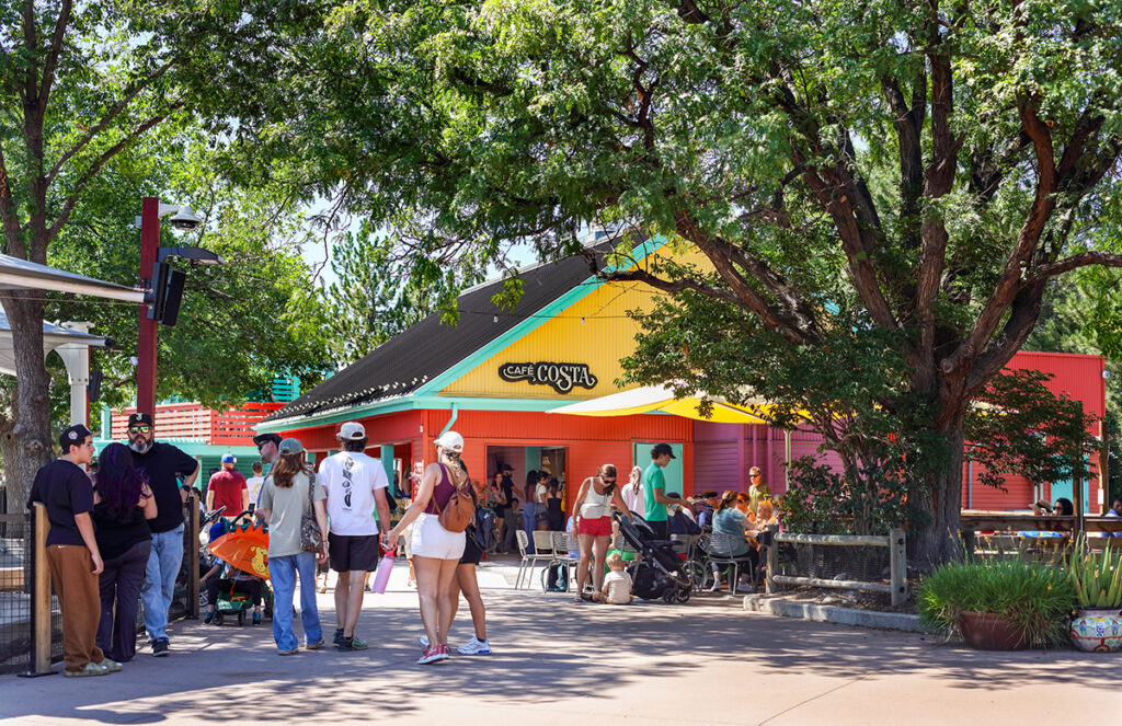 zoo patrons with architecture in the background